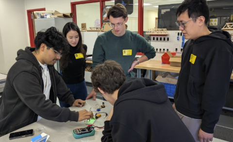 A moment of teamwork between DVISD interns and UT Austin mentors Su Ann Low, Michal Podolinsky, and Philip Zhao during the fall hardware phase.