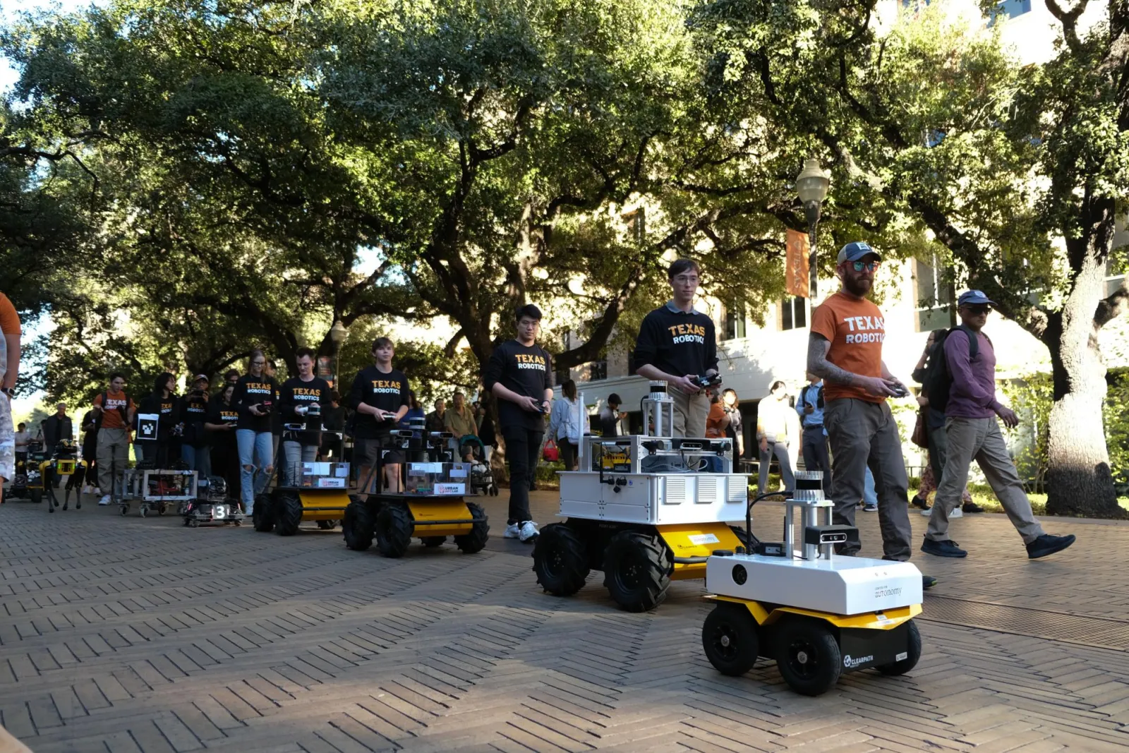 Robots belonging to Texas Robotics stroll through Seedway as part of the UT Year of AI Robot Parade on Nov 15. 2024 Robots belonging to Texas Robotics stroll through Seedway as part of the UT Year of AI Robot Parade on Nov 15. 2024