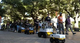 Robots belonging to Texas Robotics stroll through Seedway as part of the UT Year of AI Robot Parade on Nov 15. 2024