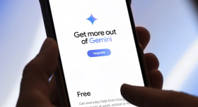 Photo of cell phone with Gemini website on screen