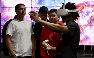 Student looking through virtual headset in TACC lab