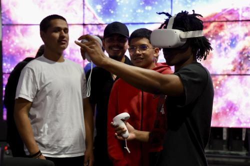 Student looking through virtual headset in TACC lab