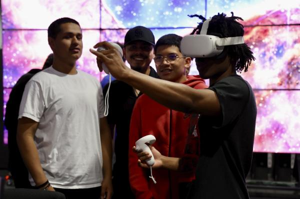 Student looking through virtual headset in TACC lab
