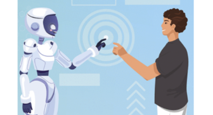 Photo of a robot and human interacting